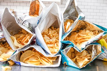 Side view of open bags of potato chips