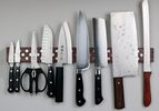 kitchen knives lined up on a magnetic knife strip